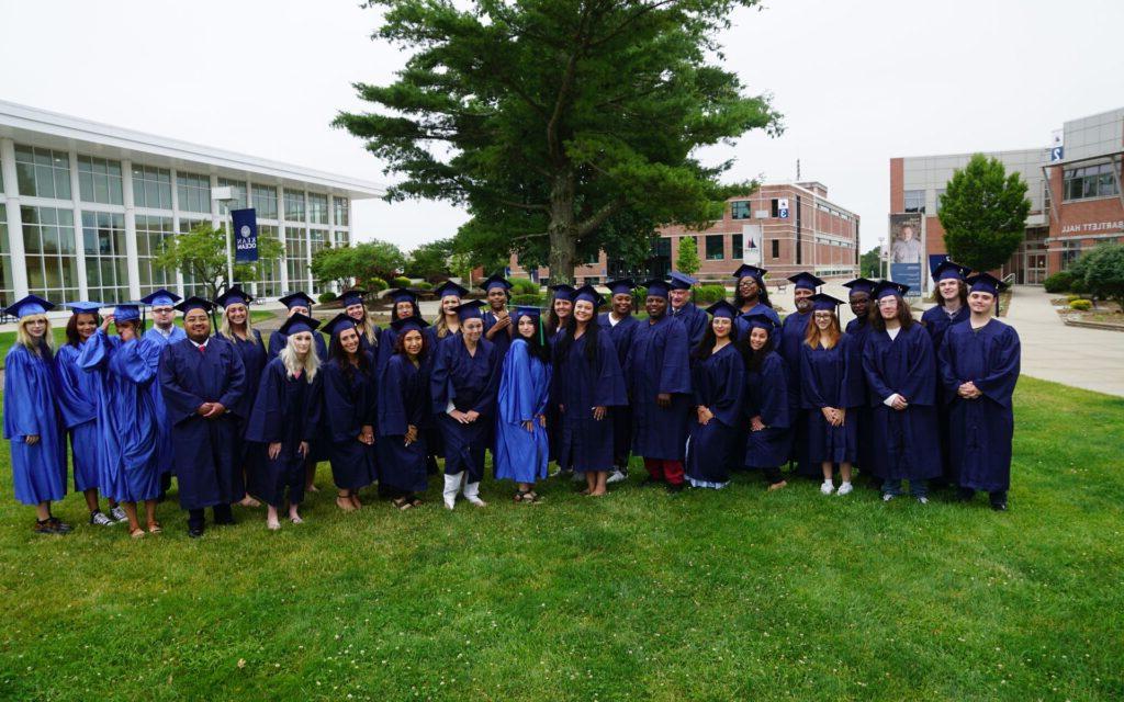 group photo of graduates in their cap and gowns